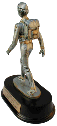 Pewter color with gold color trim statue of hiker with backpack